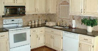 This image shows a kitchen cabinet that has been newly painted.