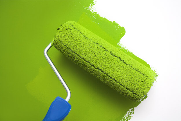 This image shows a roller brush with paint.