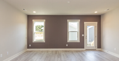 This image shows a living room. The wall is newly painted.