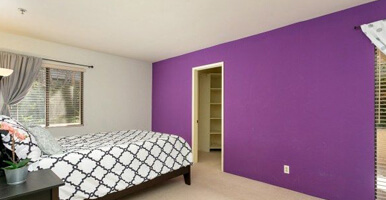 This image shows a bedroom with newly painted wall.