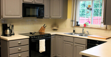 This image shows a kitchen cabinet that has been newly painted.