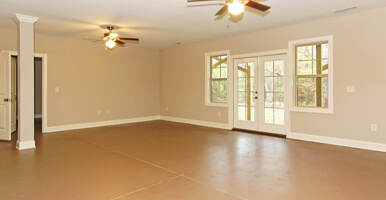 This image shows a living room with an epoxy floor.