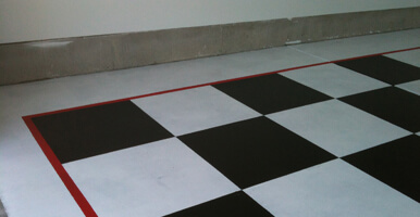 This image shows a commercial space with a white and black epoxy floor.